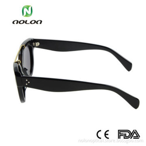 Acetate sunglasses in black with gold metal
